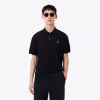 Image Polo LACOSTE L.12.12 LIGHT classic fit - Noir merle à 83€